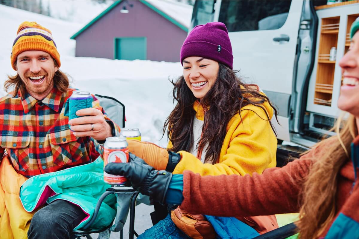 Friends staying warm in Smartwool after a day on the slopes