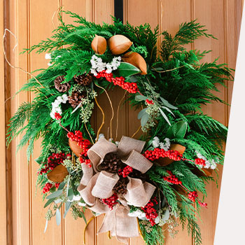 SHOP FESTIVE<br>WREATHS AND TREES